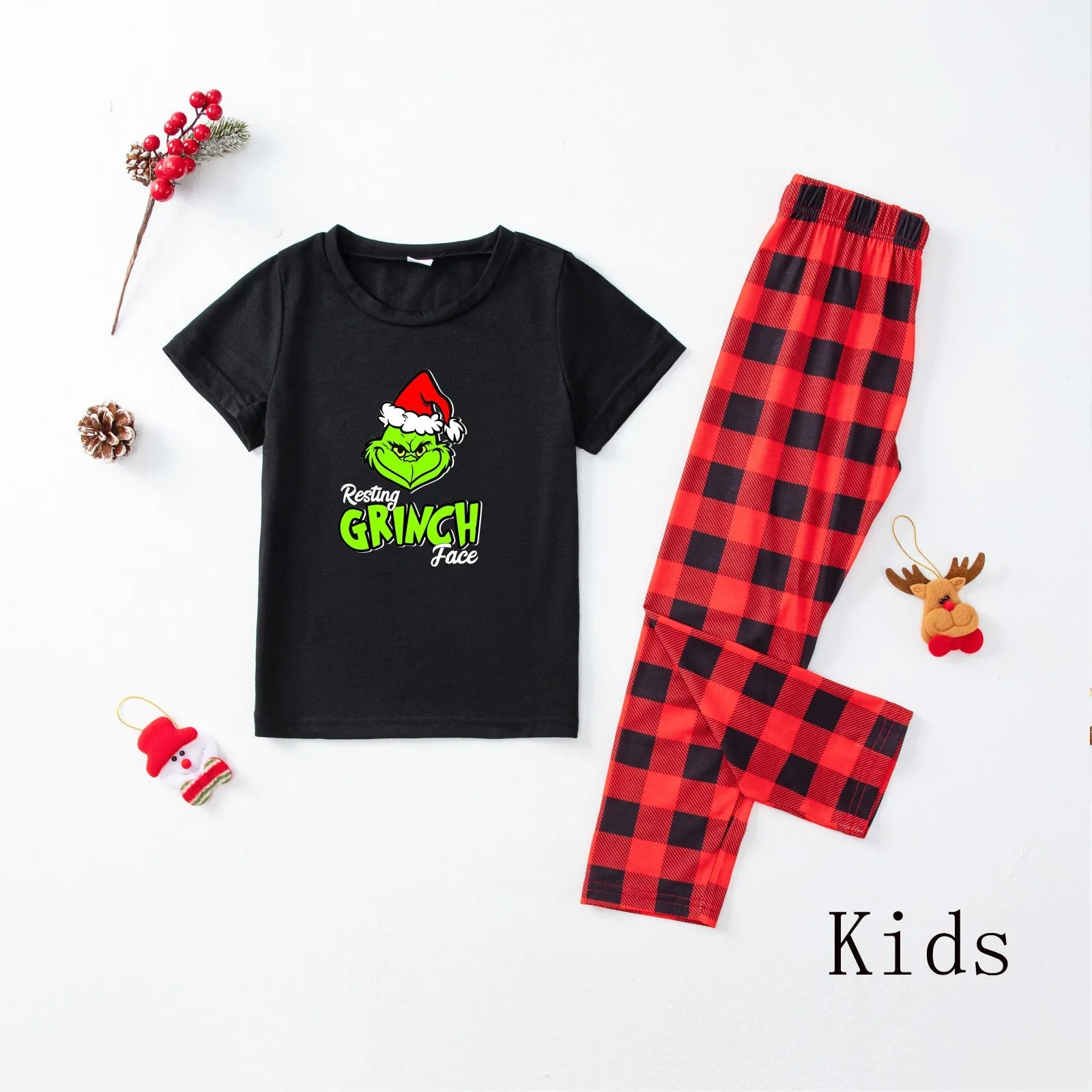 Family matching pajamas with Santa & Grinch print